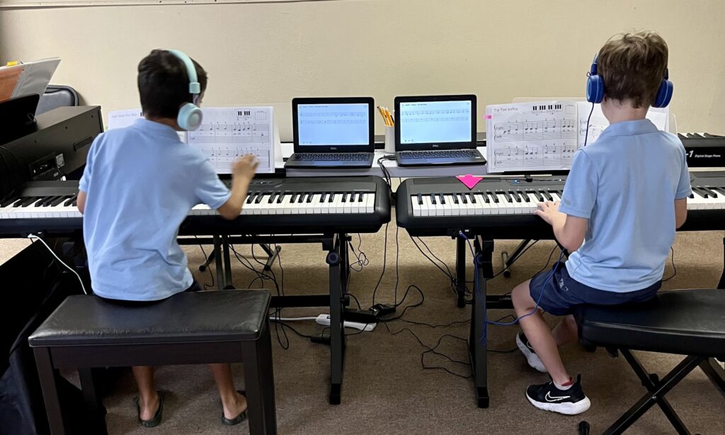 beginner piano program students