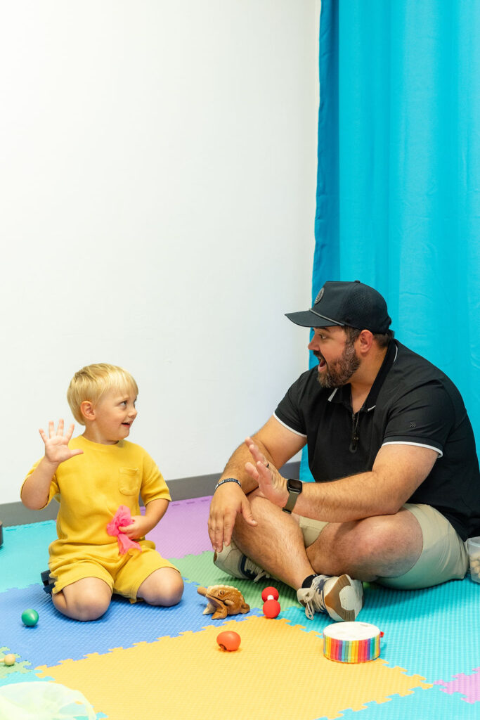 Toddler music class with child and parent.