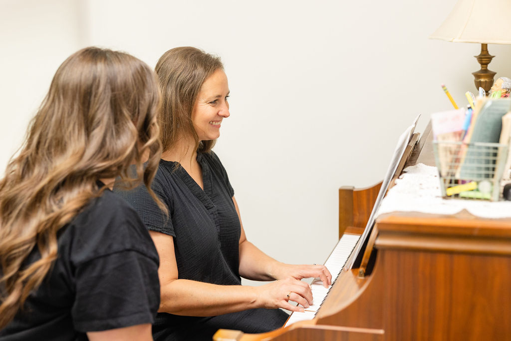 Adult piano student and teacher during music lessons in Oklahoma City.